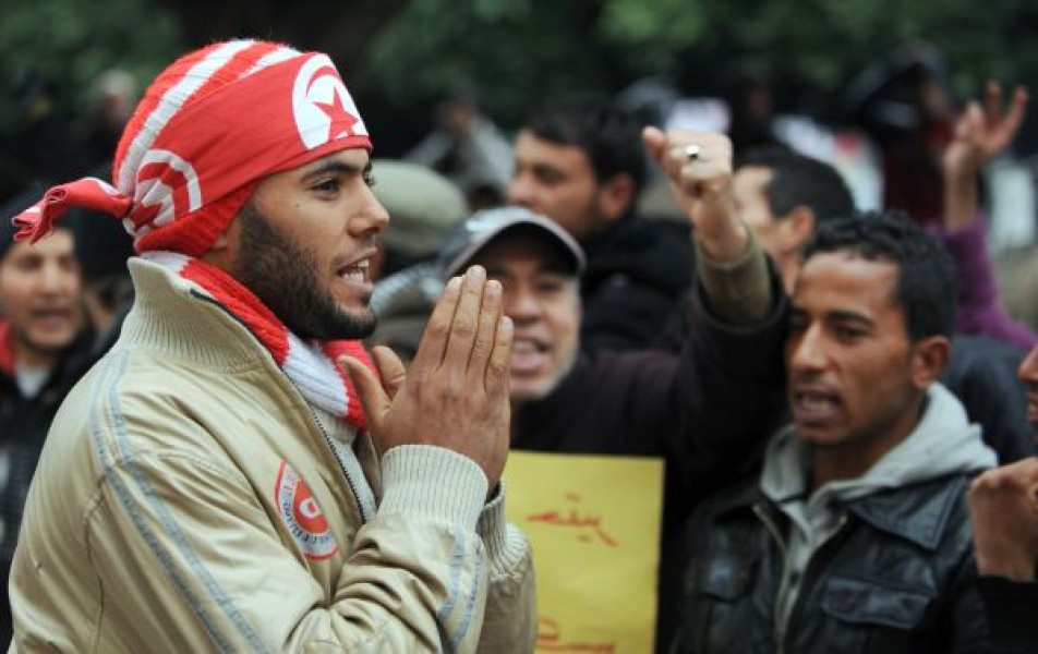 Image of a resident of central Tunisia during a demonstration in front of the Government Palace